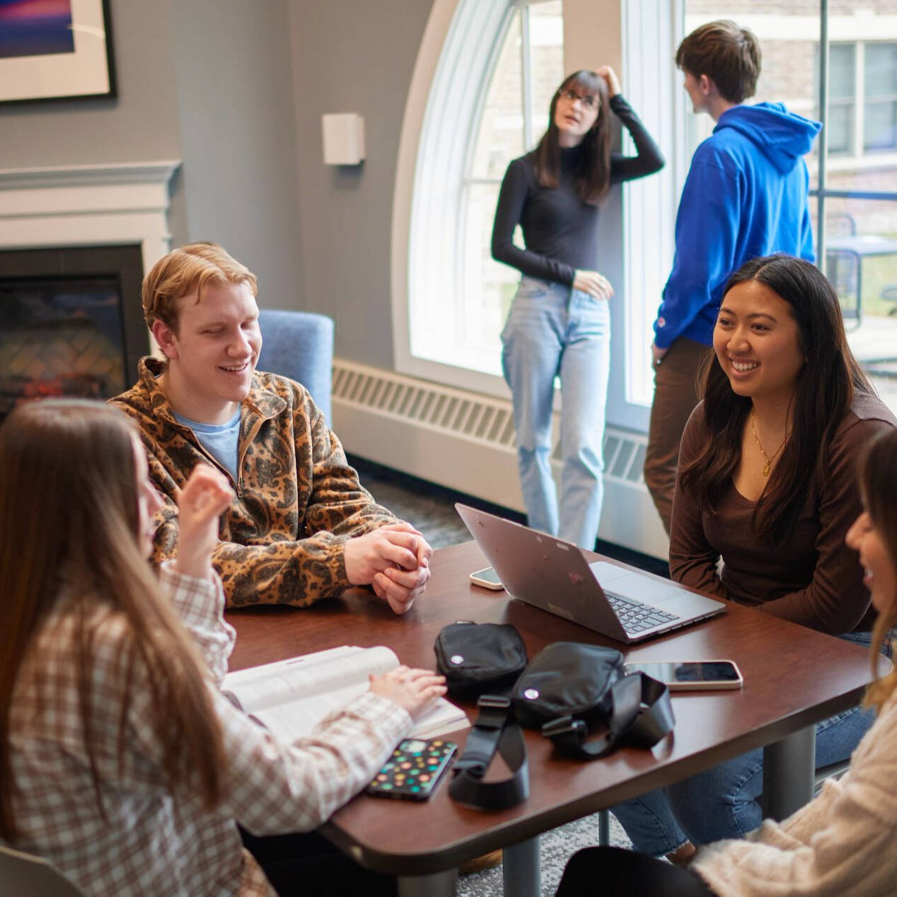 GVSU students in a housing lounge.